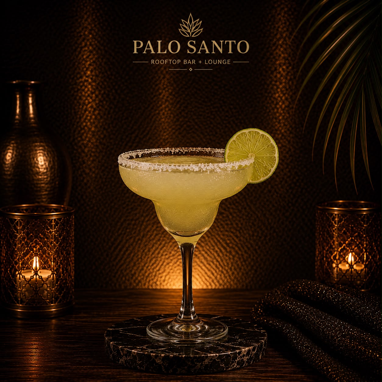 Frozen margarita with a salted rim and lime wheel