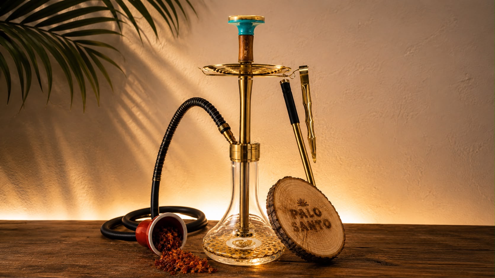 Palo Santo hookah in gold with wooden branded coaster and ambient lighting